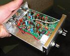 Small photograph of SW-80+ QRP CW transceiver in its case.  Click for a large image