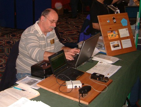 Photograph of the Morse decoding exhibit and John M0CDL working on his laptop at the NARSA Norbreck Rally in April 2010