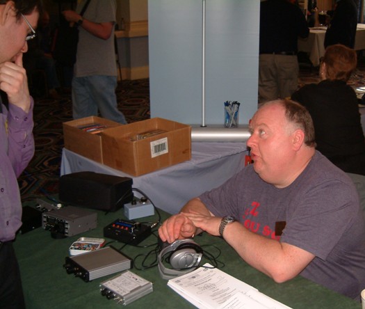 Photograph of Paul M0BMN discussing his QRP (low power) CW transceivers with a visitor at the NARSA Norbreck Rally in April 2010