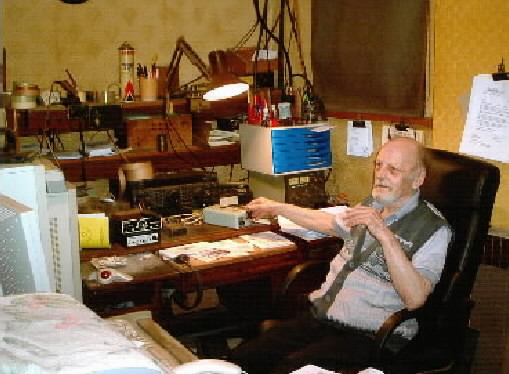 Photograph of Geo Longden G3ZQS in his shack