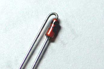 Photograph of a diode with wire bent into hook