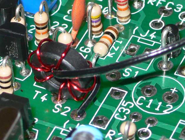 Close up photograph of T4 fitted to PCB with one side of secondary fitted